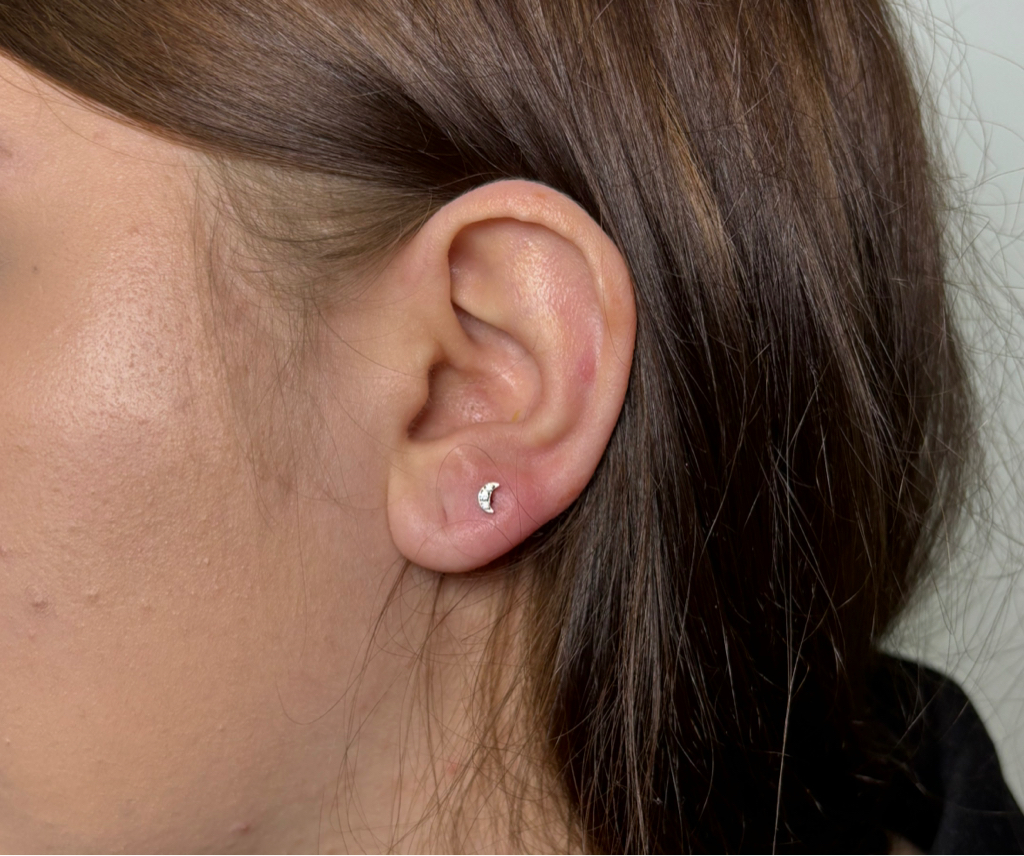 Прокол мочки уха