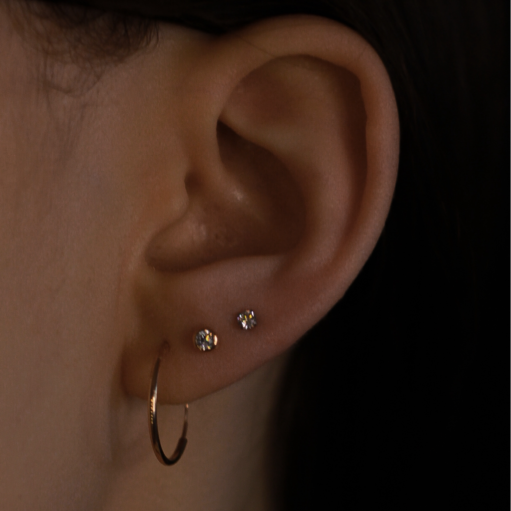 Прокол мочки уха (два прокола)