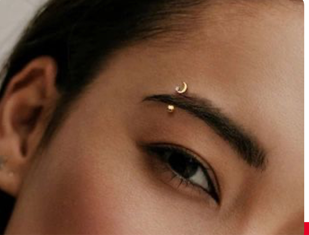 Прокол брови